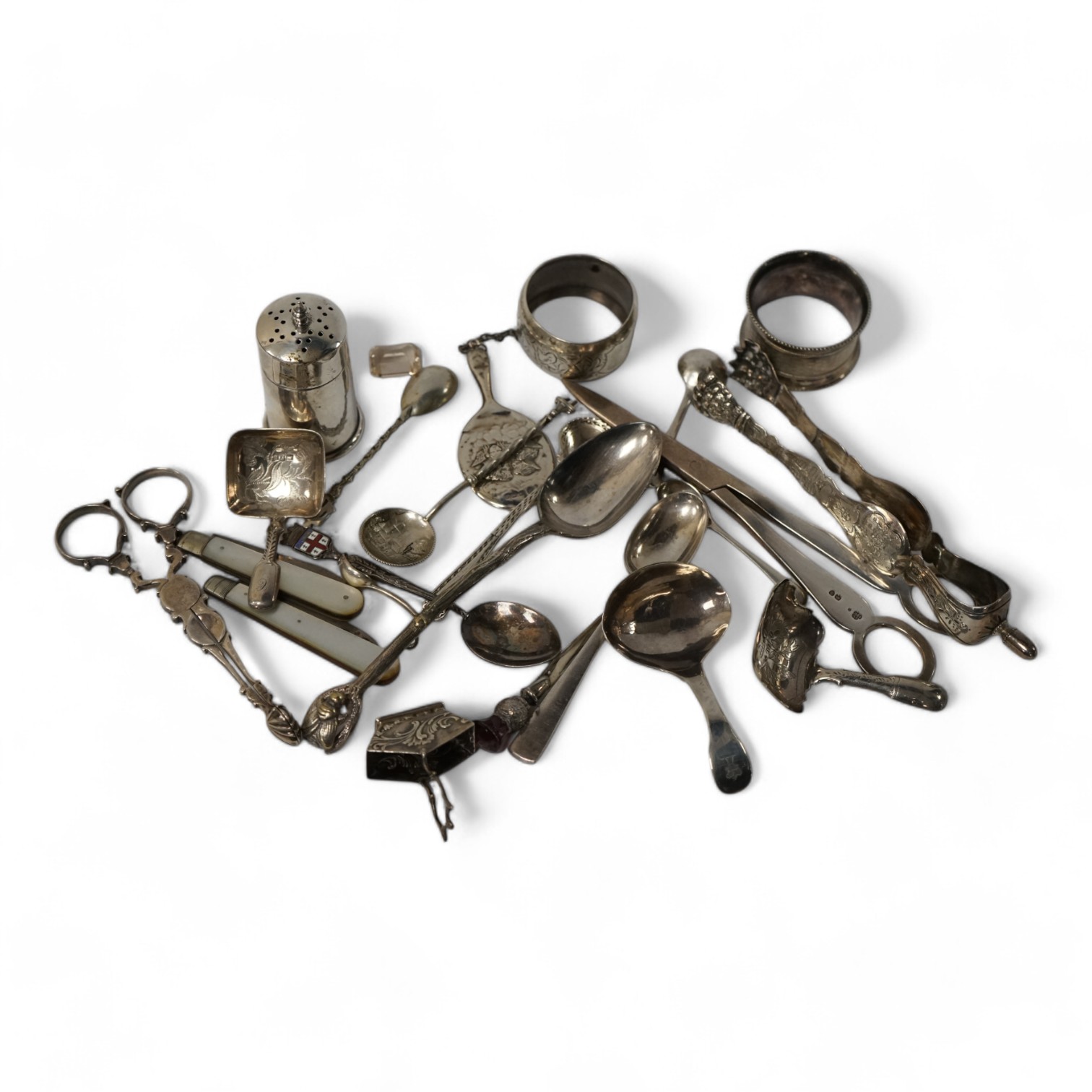 Assorted small silver and other white metal items including fruit knives, a pair of Georgian sugar nips, by Henry Plumpton, circa 1750, a pair of Victorian grape shears, Wakely & Wheeler, London 1887, pepperette, a Georg